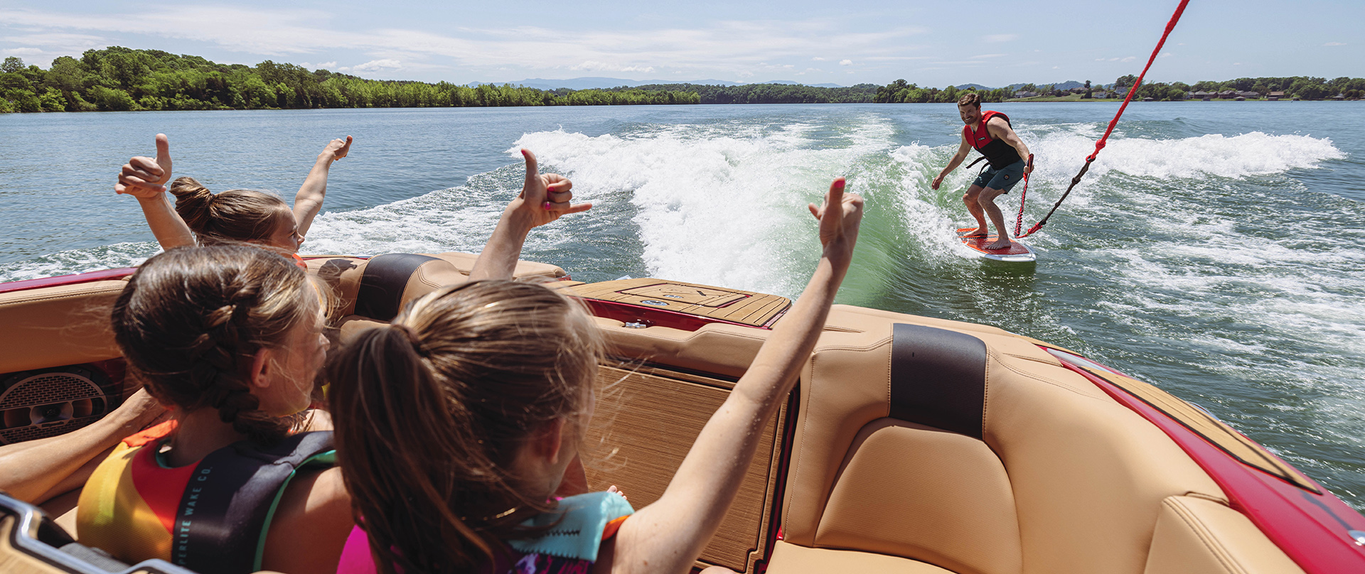 Wake surfing behind a Mastercraft. For Sale at Port Sandfield Marina