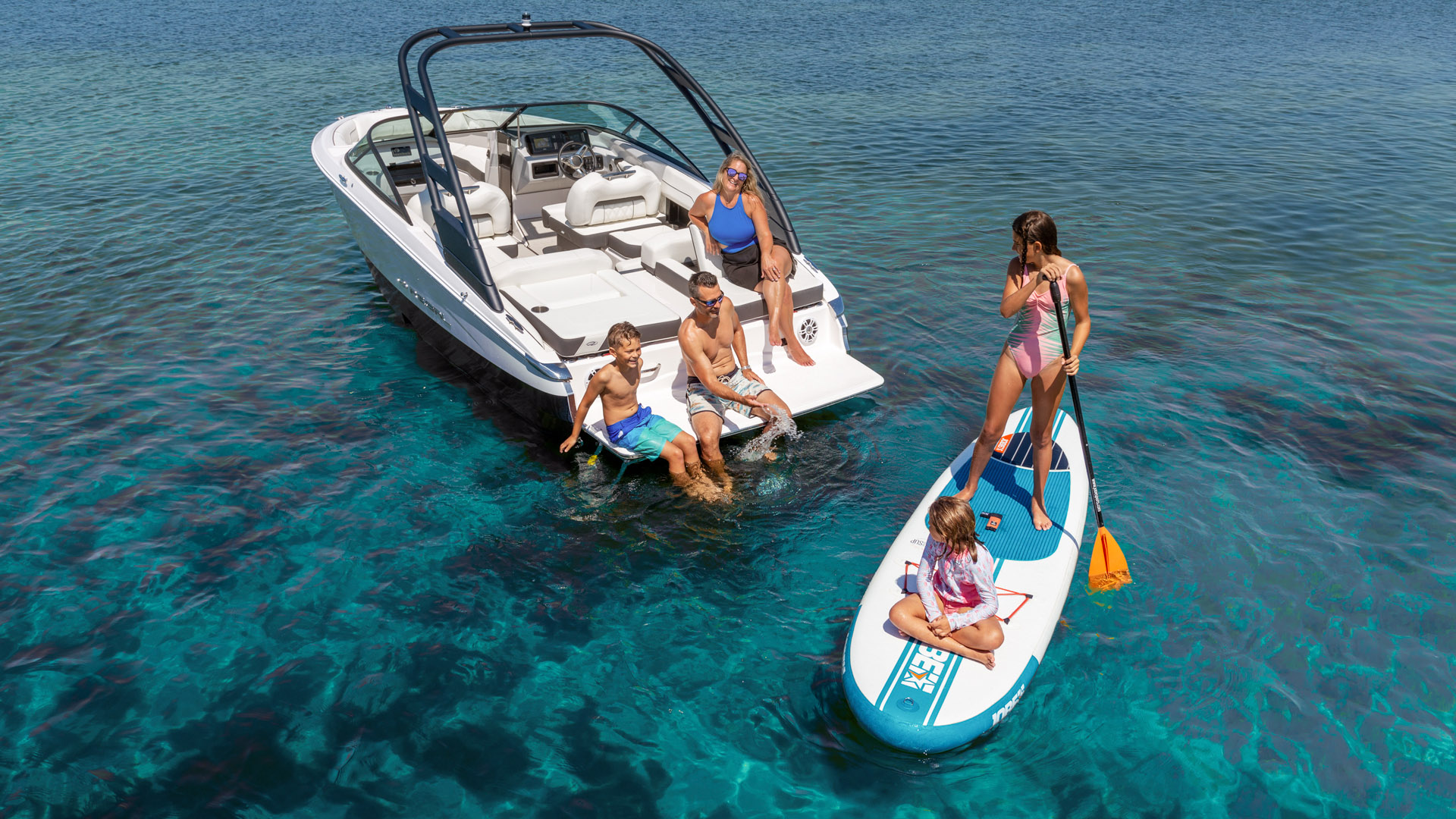 Family enjoying a Regal luxury boat rental from Port Sandfield Marina