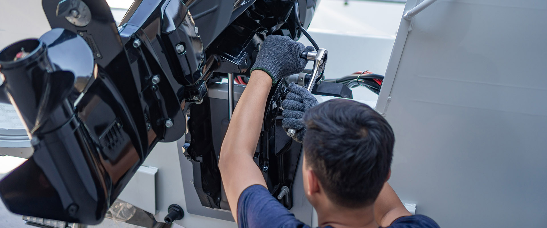 Mechanic fixing boat in Service Department at Port Sandfield